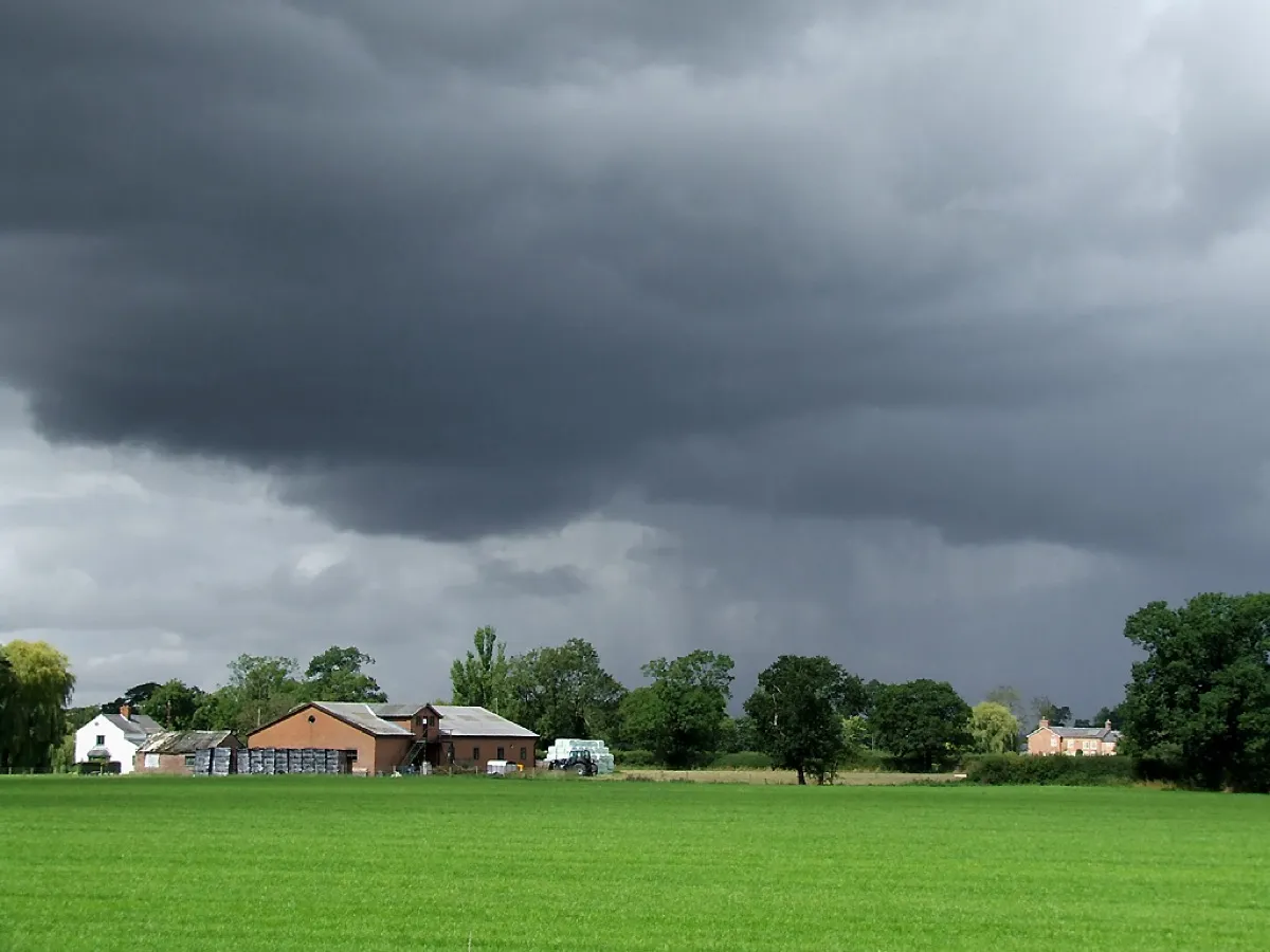 storm clouds over farmland